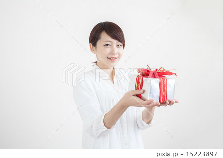 プレゼントを差し出す女性の写真素材