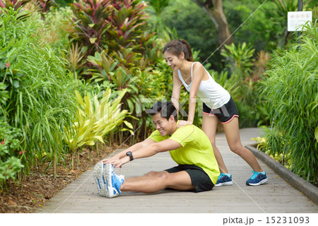 Young Chinese couple doing stretching exercise Young Chinese couple doing stretching exercise 15231093