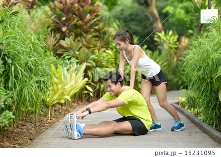 Young Chinese couple doing stretching exercise 15231095
