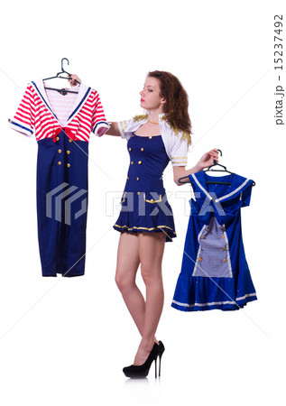 Woman trying to choose dress on white Woman trying to choose dress on white 15237492