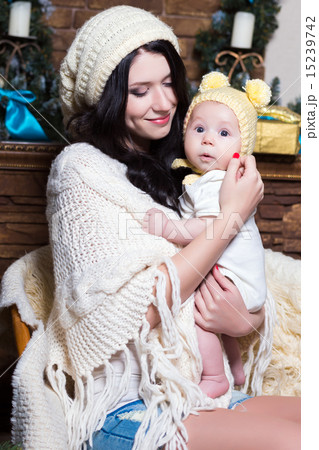 Woman holding her baby 15239742