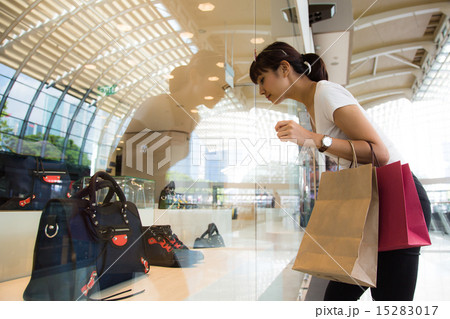 Women shopping in Singapore mall Women shopping in Singapore mall 15283017