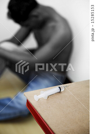 Syringe and drug addict 15285153
