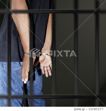 Prisoner locked in handcuffs 15285377