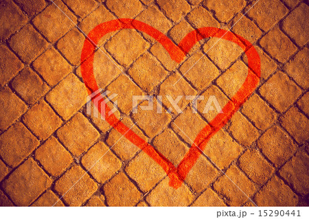 Heart painted on a stone wall 15290441