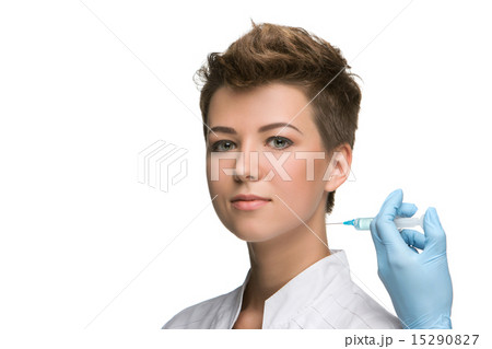 pretty young woman and vaccine syringe 15290827