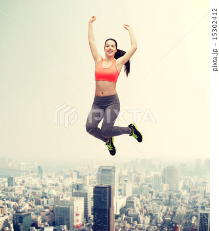 sporty teenage girl jumping in sportswear sporty teenage girl jumping in sportswear 15302412