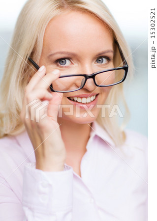 smiling businesswoman or secretary in office smiling businesswoman or secretary in office 15302521