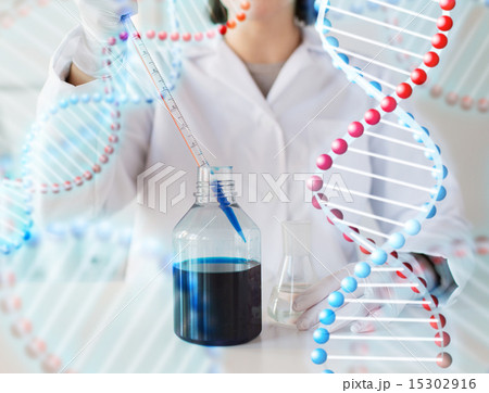 close up of scientist making test in lab close up of scientist making test in lab 15302916