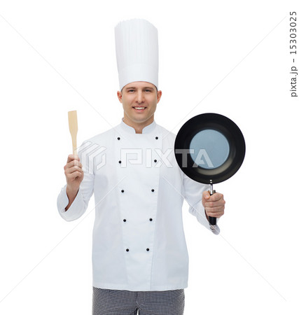 happy male chef holding frying pan and spatula happy male chef holding frying pan and spatula 15303025
