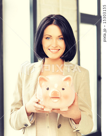 lovely woman with piggy bank lovely woman with piggy bank 15303155