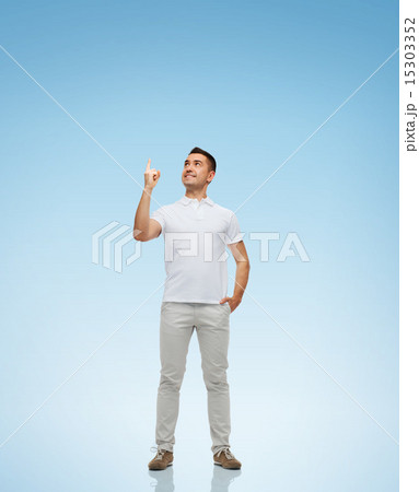 smiling man pointing finger up 15303352