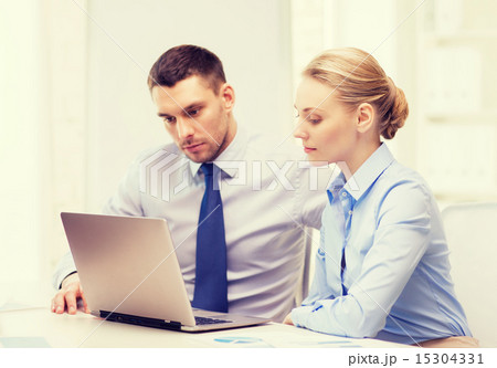 business team working with laptop in office 15304331