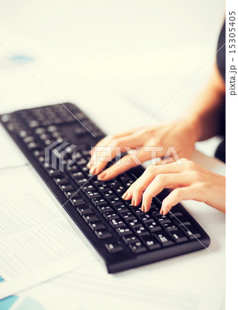 woman hands typing on keyboard woman hands typing on keyboard 15305405
