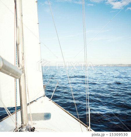 Yacht sailing towards the sunset Yacht sailing towards the sunset 15309530