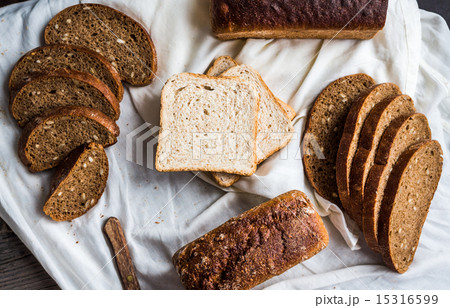 assortment of baked bread, slices of rye bread 15316599