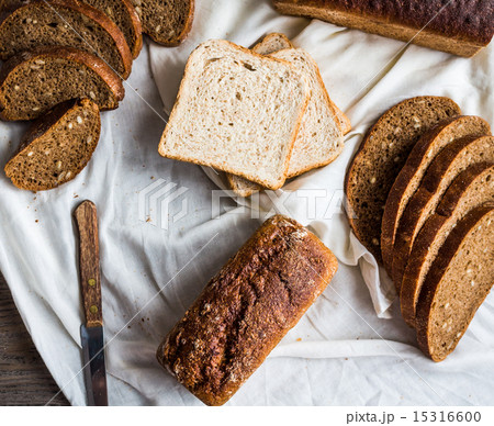 assortment of baked bread, slices of rye bread 15316600