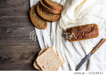 bread, slices of rye bread on linen tablecloths bread, slices of rye bread on linen tablecloths 15316621
