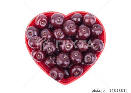 Cherries on  plate in the shape of a heart . Cherries on  plate in the shape of a heart . 15318354