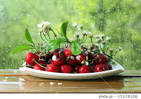 cherries in a bowl on the window 15328106