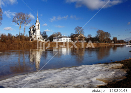 Spring flood church on the bank 15329143