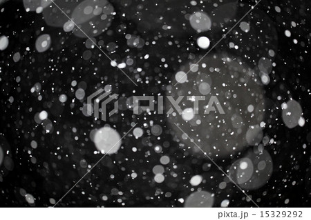 snow bokeh texture on black background 15329292