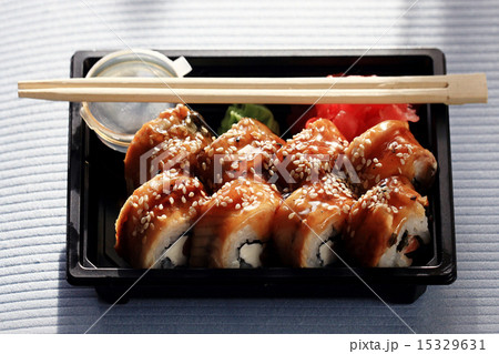 delivery service Japanese food rolls in plastic box 15329631