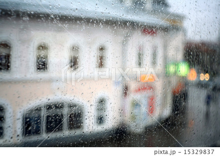 window rain blurred city lights 15329837