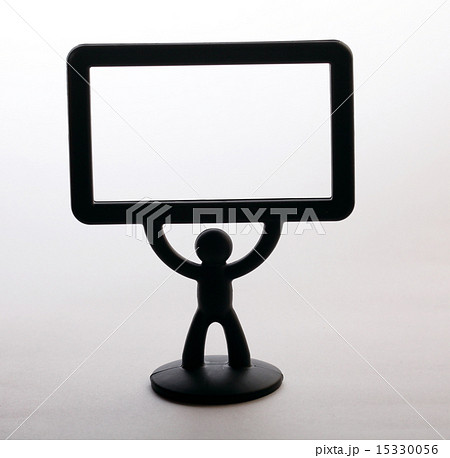 plastic figurine of a man with a placard on white background 15330056