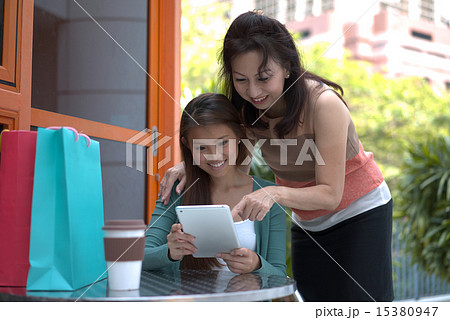 People of two generation using wireless tablet  15380947