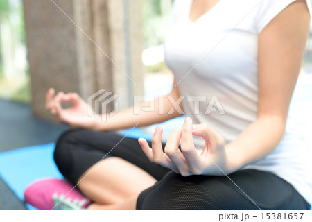 Close up of young Chinese woman doing yoga 15381657