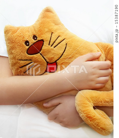 Little girl hugging toy cat 15387190