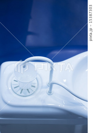 Dentist water cup tap filler in dental clinic 15387303