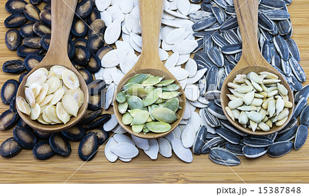 Variety of edible seeds in wood spoon Variety of edible seeds in wood spoon 15387848