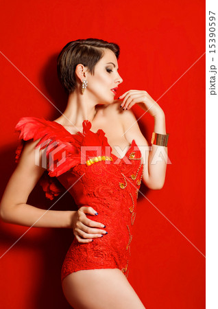 Young beautiful girl in red dancing suit  15390597