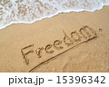 Word FREEDOM on the beach. 15396342