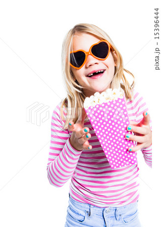 Girl eating pop corn Girl eating pop corn 15396444