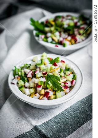 Vegetable salad on wooden background Vegetable salad on wooden background 15396572
