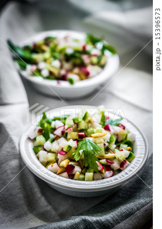 Vegetable salad on wooden background Vegetable salad on wooden background 15396573