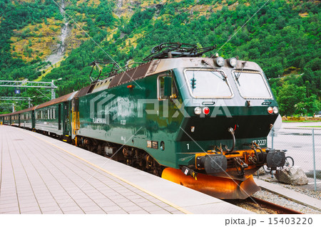 Flamsbahn In Flam, Norway. Green Train On Railway 15403220