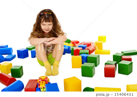 Angry little girl among the scattered toys 15406431