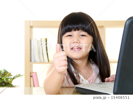 Cute asian girl using laptop and thumbs up 15406551