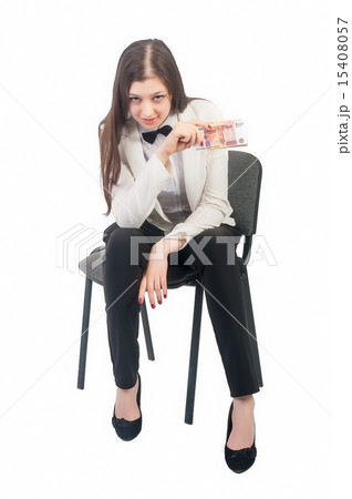 Pretty businesswoman with roubles sits on chair 15408057
