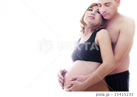 Pregnant asian wife and a happy husband acting hug Pregnant asian wife and a happy husband acting hug 15415235