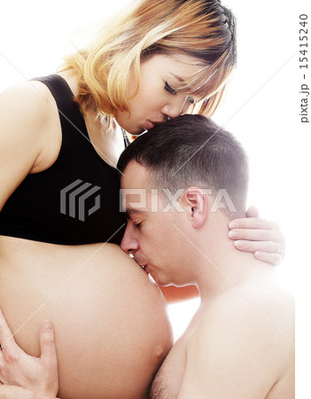 Pregnant asian wife and a happy husband Kissing 15415240