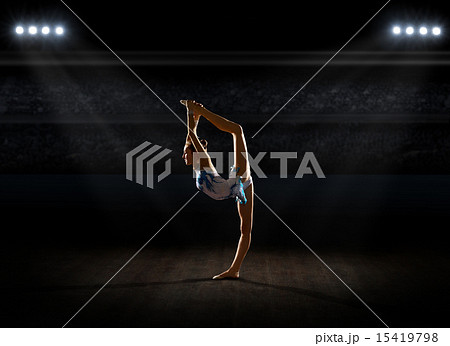 Girl engaged art gymnastic at sports hall Girl engaged art gymnastic at sports hall 15419798