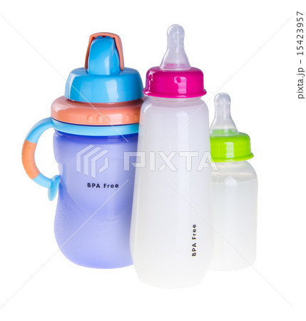 Baby bottle with milk on background Baby bottle with milk on background 15423957
