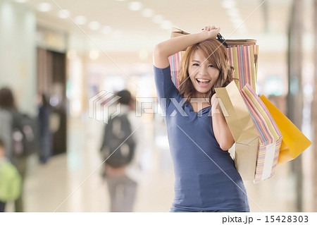 Cheerful shopping woman 15428303