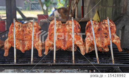 Roast chicken on grill 15428992