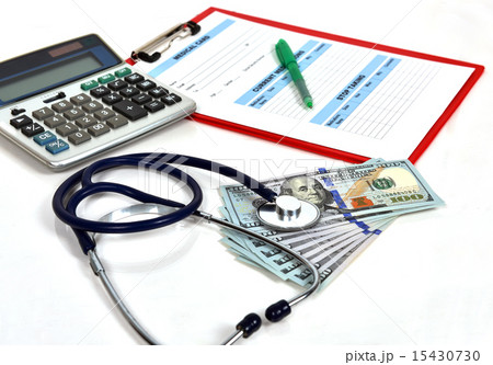 Stethoscope and dollar bills Stethoscope and dollar bills 15430730